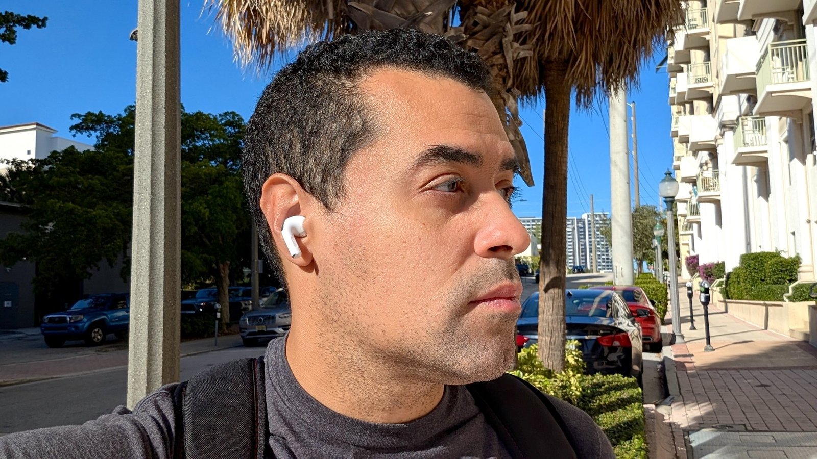 the author wearing AirPods Pro 3